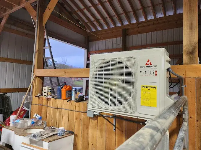 The yellow EnergyGuide efficiency label on a newly installed ductless mini split condenser